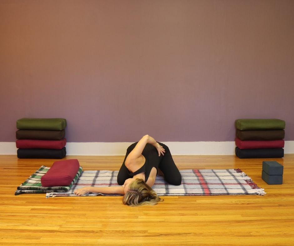 blog post yin yoga childs pose with twist jennifer raye